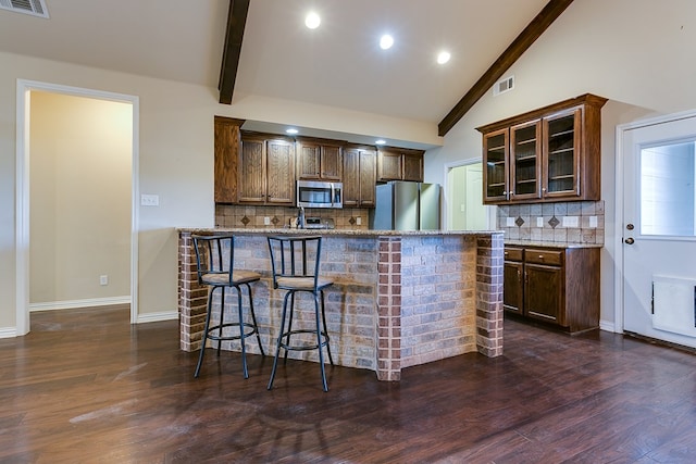 kitchen with visible vents, glass insert cabinets, dark wood-style flooring, beamed ceiling, and stainless steel appliances