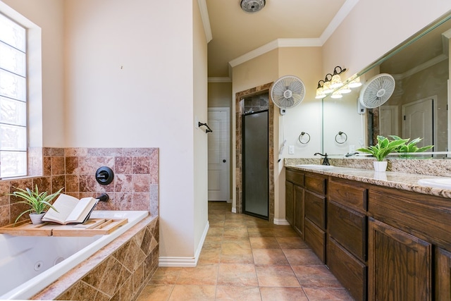 full bath with double vanity, a stall shower, a tub with jets, crown molding, and a sink