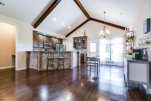 kitchen with tasteful backsplash, dark wood-style floors, glass insert cabinets, appliances with stainless steel finishes, and beam ceiling