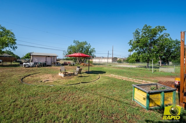 113 N Belaire Ave, San Angelo, TX 76905 - view of yard featuring a shed and an outdoor fire pit