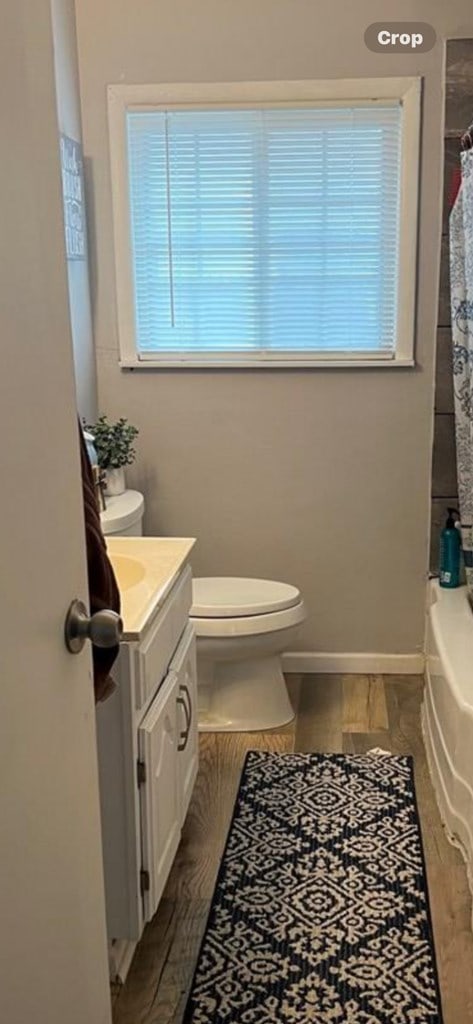 2525 Tcu Ave, San Angelo, TX 76904 - full bath featuring toilet, vanity, and baseboards