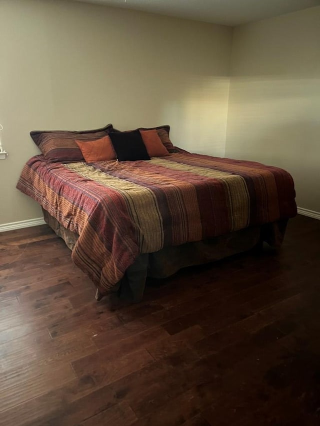 bedroom featuring dark hardwood / wood-style flooring