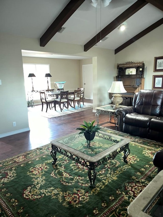 living room featuring hardwood / wood-style floors and lofted ceiling with beams