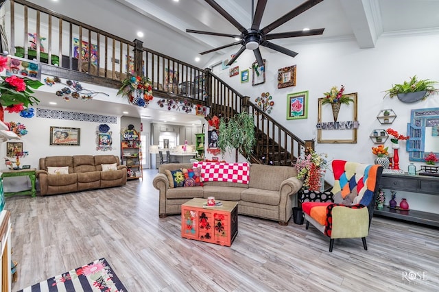 1920 Shady Point Circle Dr, San Angelo, TX 76904 - living area with a ceiling fan, wood finished floors, beam ceiling, stairs, and a towering ceiling