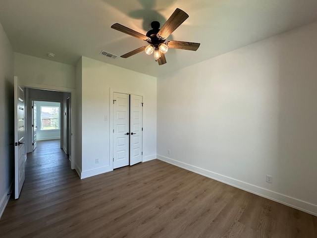 3615 Clearview Dr, San Angelo, TX 76904 - unfurnished bedroom with dark wood-style floors, a closet, and ceiling fan