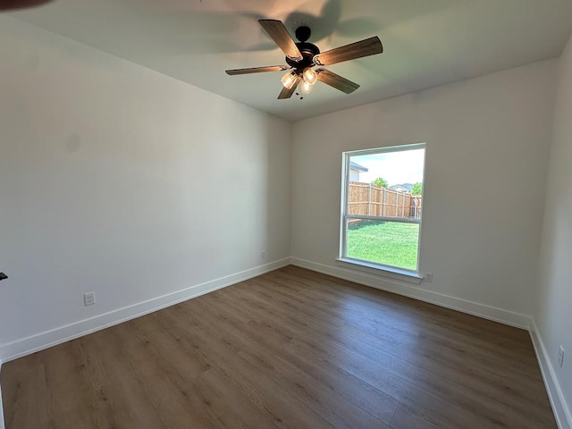 3615 Clearview Dr, San Angelo, TX 76904 - unfurnished room featuring dark wood-type flooring and a ceiling fan