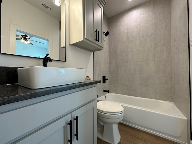 3615 Clearview Dr, San Angelo, TX 76904 - full bathroom featuring vanity, wood finished floors, shower / tub combination, and ceiling fan