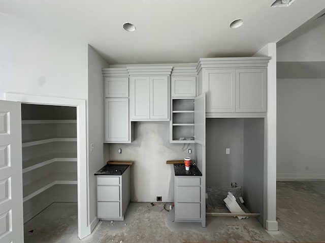 kitchen featuring dark countertops