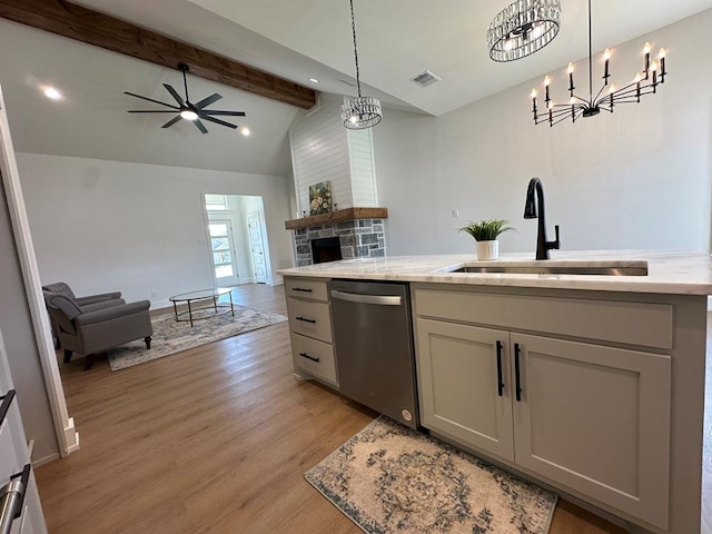 3615 Clearview Dr, San Angelo, TX 76904 - kitchen featuring stainless steel dishwasher, open floor plan, light wood-type flooring, beamed ceiling, and decorative light fixtures