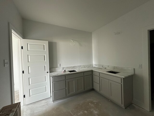 bathroom with unfinished concrete flooring