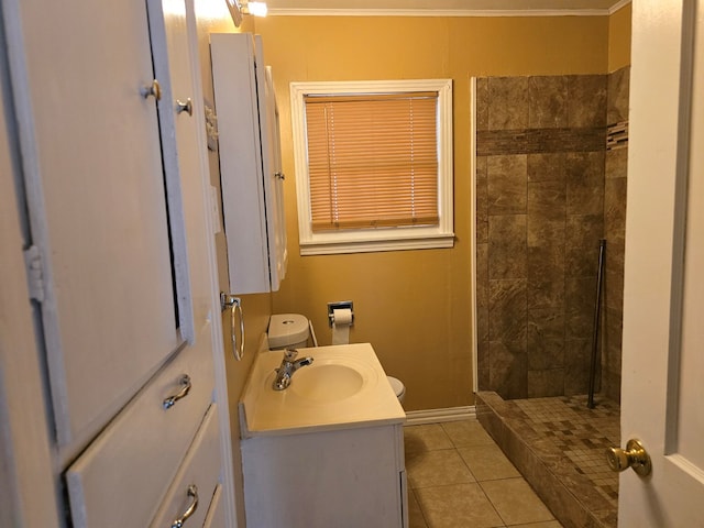 42 W 26th St, San Angelo, TX 76903 - bathroom with vanity, a tile shower, tile patterned flooring, and ornamental molding