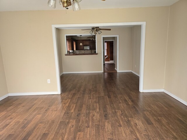 42 W 26th St, San Angelo, TX 76903 - unfurnished room featuring wood finished floors, baseboards, and a ceiling fan