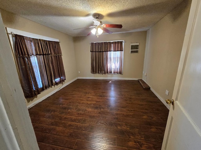 42 W 26th St, San Angelo, TX 76903 - empty room featuring wood-type flooring, a ceiling fan, a textured ceiling, and baseboards