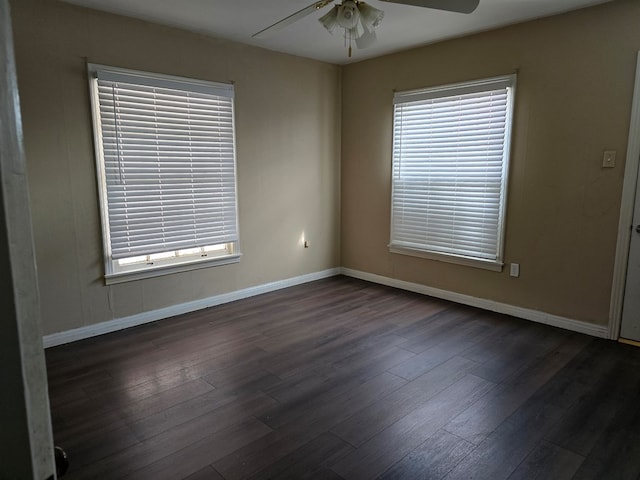 42 W 26th St, San Angelo, TX 76903 - empty room featuring ceiling fan, dark wood-style flooring, and baseboards