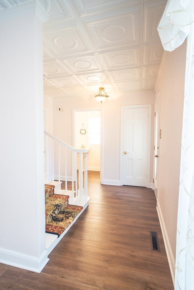 hallway featuring wood-type flooring