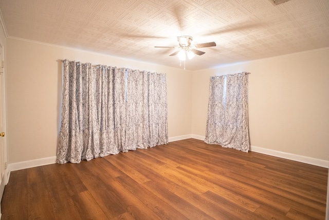 empty room with hardwood / wood-style flooring and ceiling fan