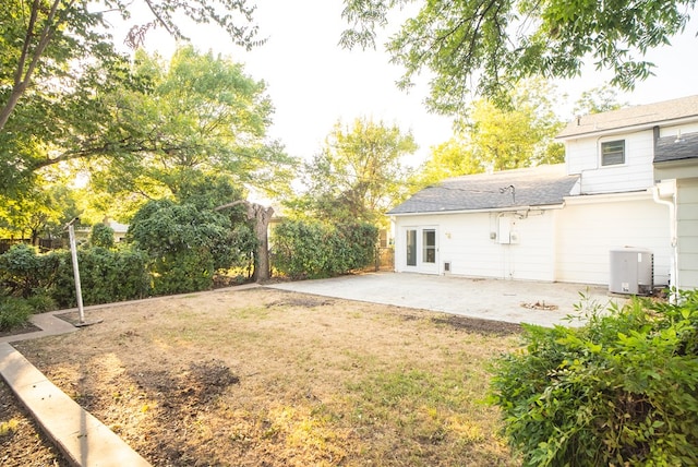 view of yard featuring central AC and a patio area