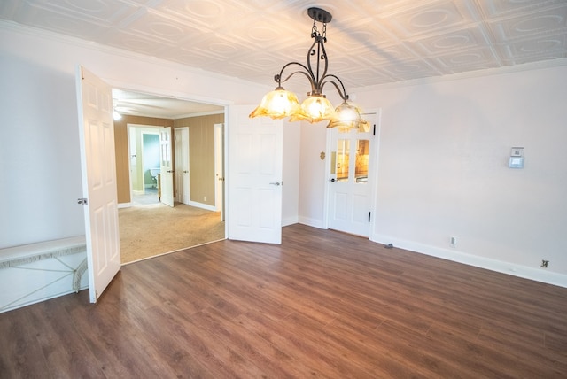 unfurnished dining area with crown molding and dark hardwood / wood-style flooring