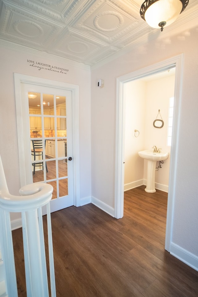 hall featuring dark wood-type flooring and sink