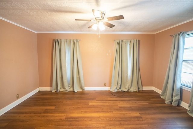 unfurnished room featuring hardwood / wood-style flooring, ornamental molding, and ceiling fan