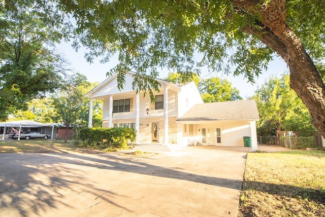 neoclassical home featuring a garage