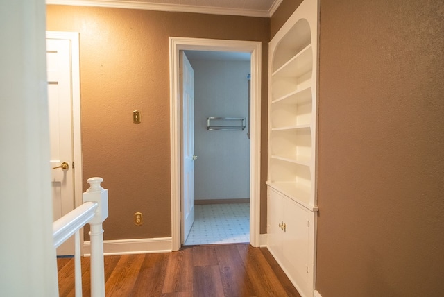 hallway with crown molding and dark hardwood / wood-style flooring