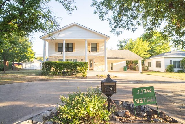 greek revival house with a carport