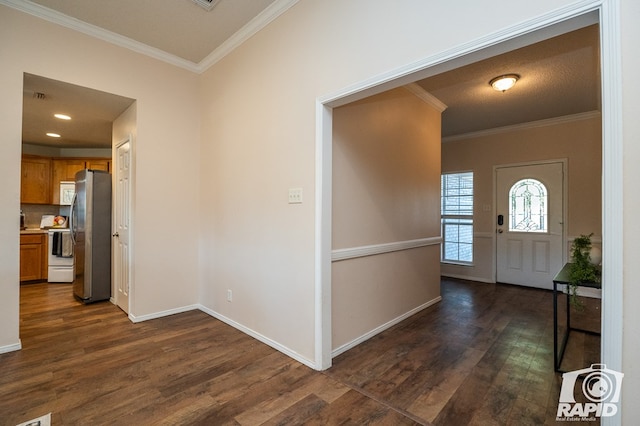 foyer featuring ornamental molding and dark hardwood / wood-style flooring