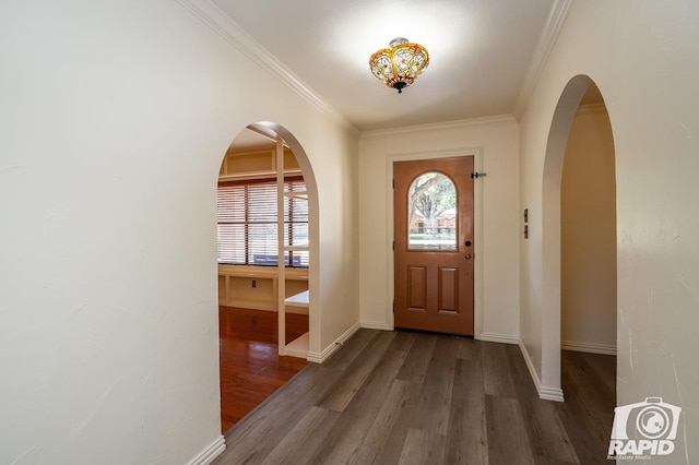 entrance foyer with dark wood-type flooring and crown molding