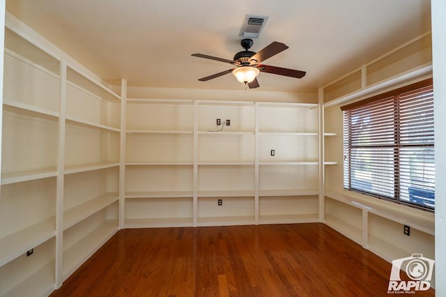 empty room featuring ceiling fan and wood-type flooring