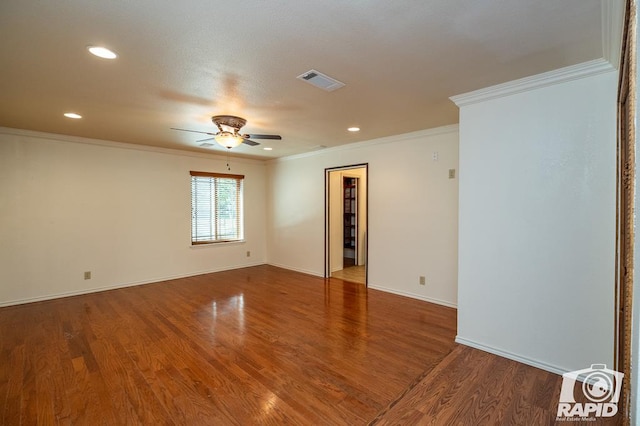 unfurnished room featuring crown molding, wood-type flooring, and ceiling fan