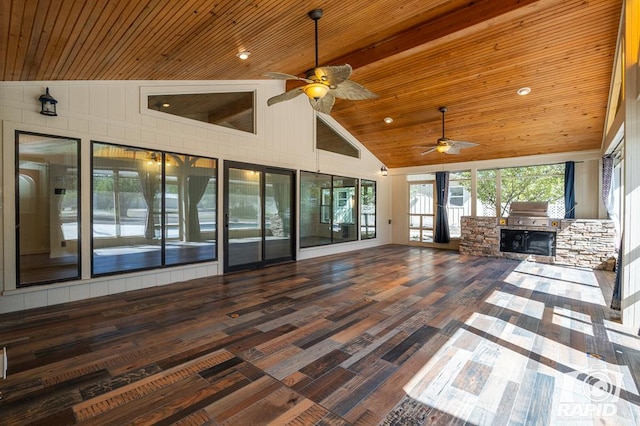 unfurnished living room with hardwood / wood-style floors, high vaulted ceiling, a fireplace, ceiling fan, and wood ceiling