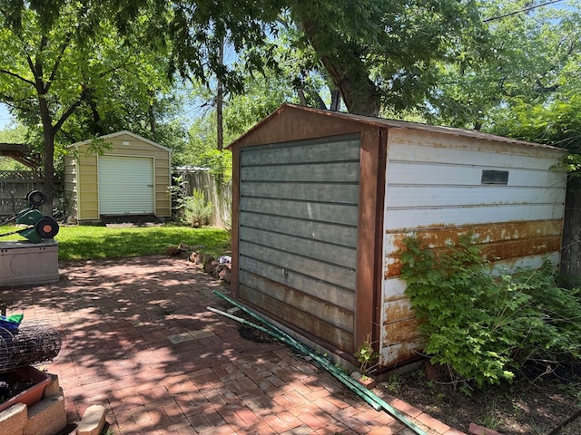view of shed with fence