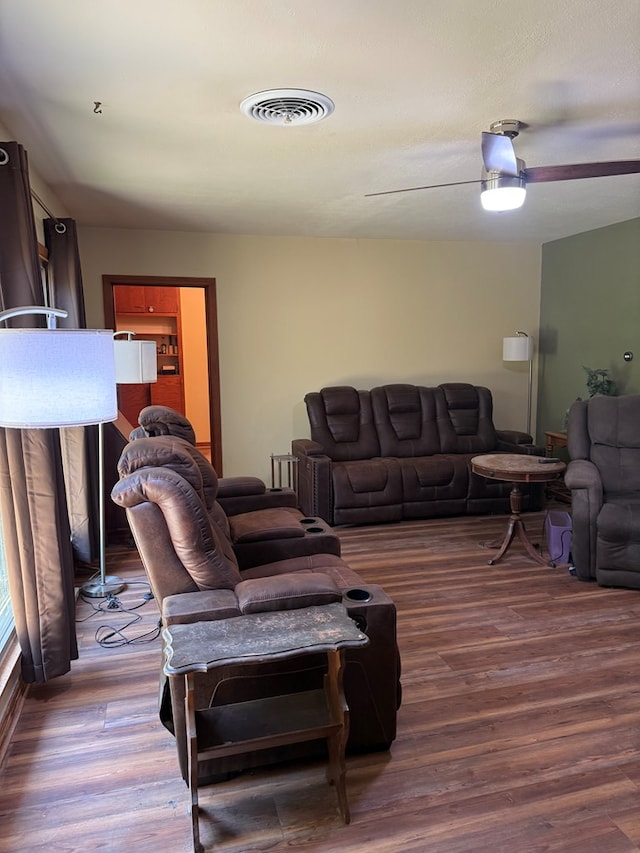 living room featuring wood finished floors and visible vents