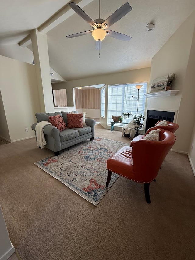 carpeted living room featuring a ceiling fan, a fireplace, baseboards, and high vaulted ceiling