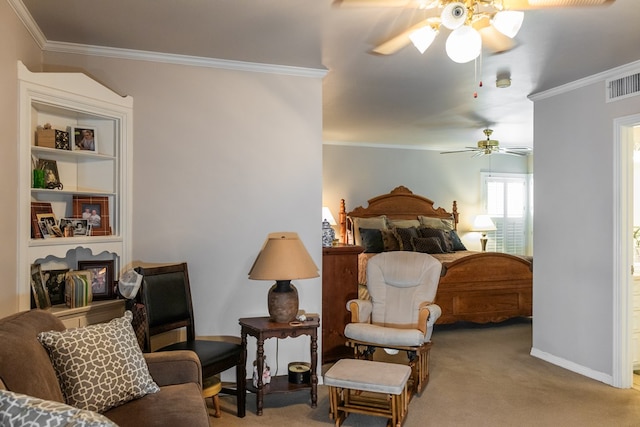 carpeted bedroom with ceiling fan and crown molding