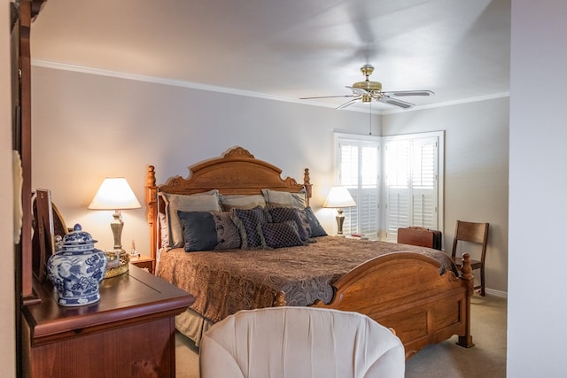 carpeted bedroom with ceiling fan and crown molding