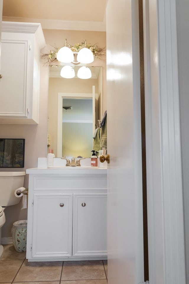 bathroom featuring tile patterned floors, toilet, and vanity