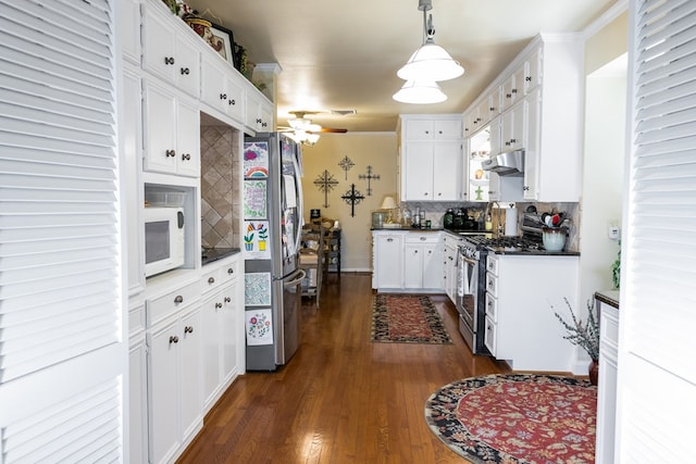 kitchen featuring stainless steel appliances, white cabinets, pendant lighting, backsplash, and dark hardwood / wood-style flooring