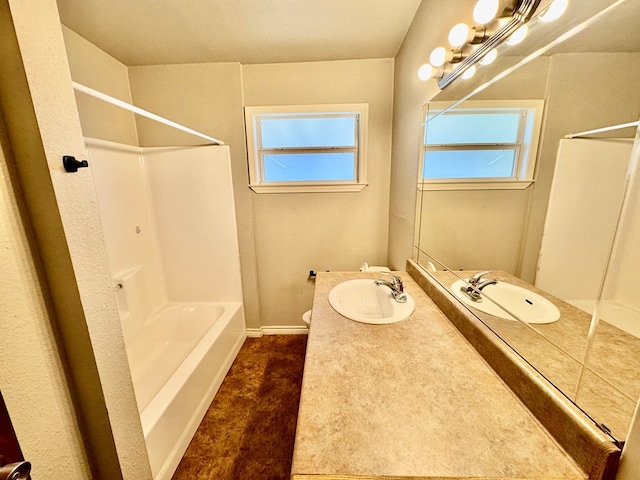 bathroom featuring vanity and bathing tub / shower combination