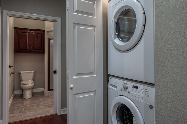 7164 Texas Unit R2, Del Rio, TX 78840 - laundry area featuring stacked washer and clothes dryer and wood finished floors