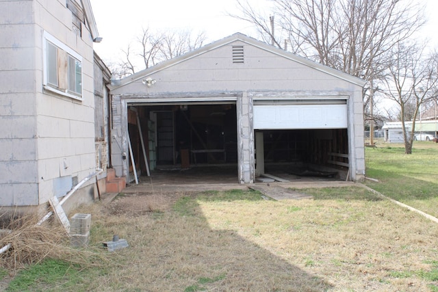 garage with a lawn