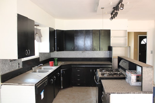 kitchen with light tile patterned flooring, sink, decorative backsplash, and black appliances