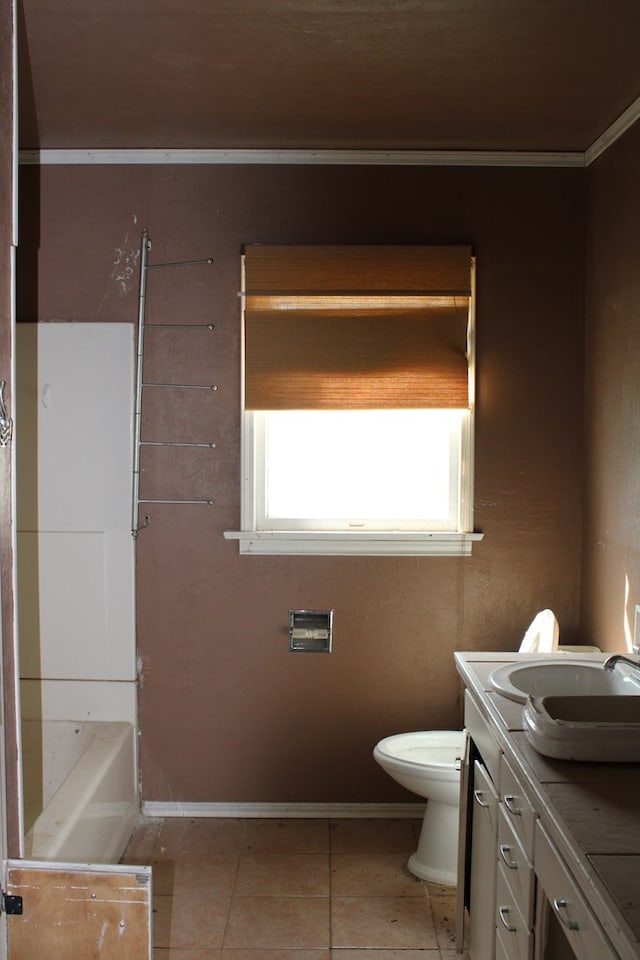 bathroom with vanity, tile patterned flooring, and toilet