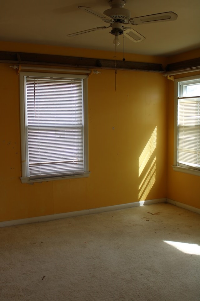 carpeted empty room with ceiling fan