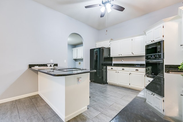 6026 Warwick Dr, San Angelo, TX 76901 - kitchen featuring black appliances, ceiling fan, arched walkways, white cabinetry, and a peninsula