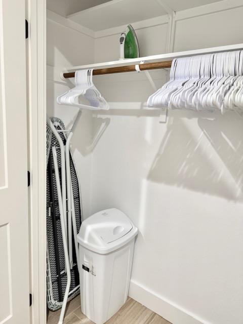 walk in closet featuring light hardwood / wood-style flooring