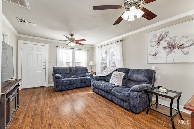 706 N Madison St, San Angelo, TX 76901 - living room featuring a ceiling fan, wood finished floors, ornamental molding, and baseboards