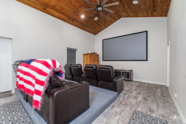 cinema room with wood-type flooring, lofted ceiling, wooden ceiling, and ceiling fan