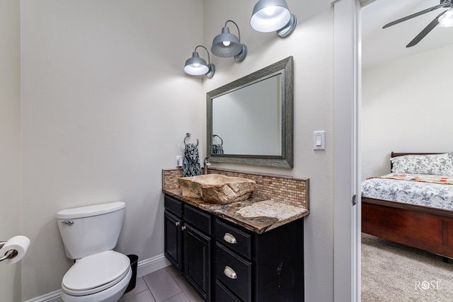 bathroom with tasteful backsplash, ceiling fan, vanity, and toilet